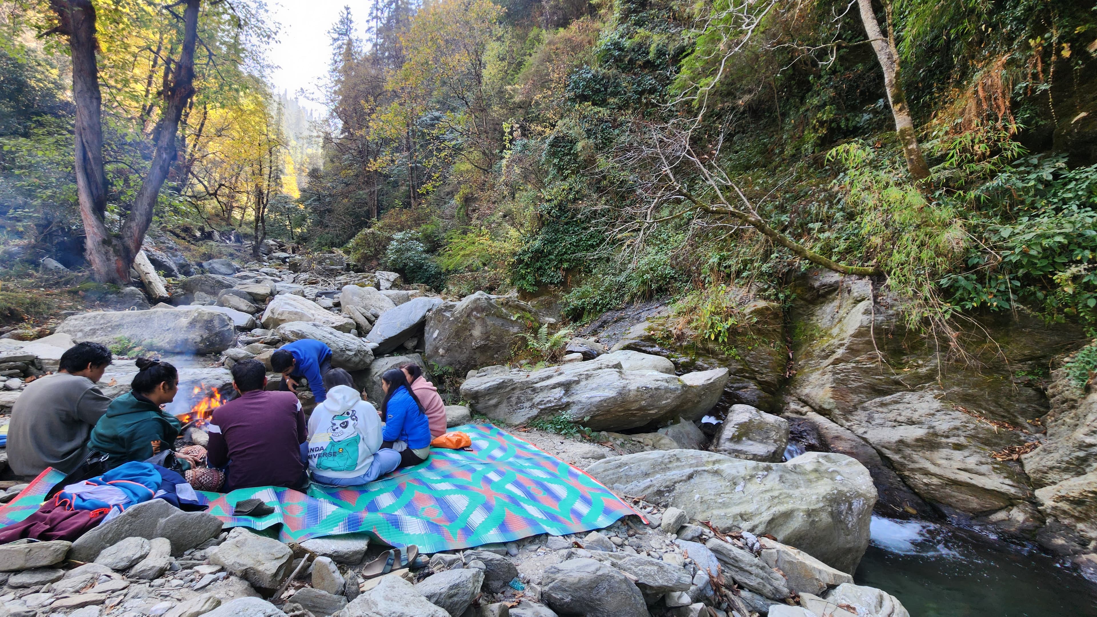 Relaxed picnic setup by the river at Ailyak