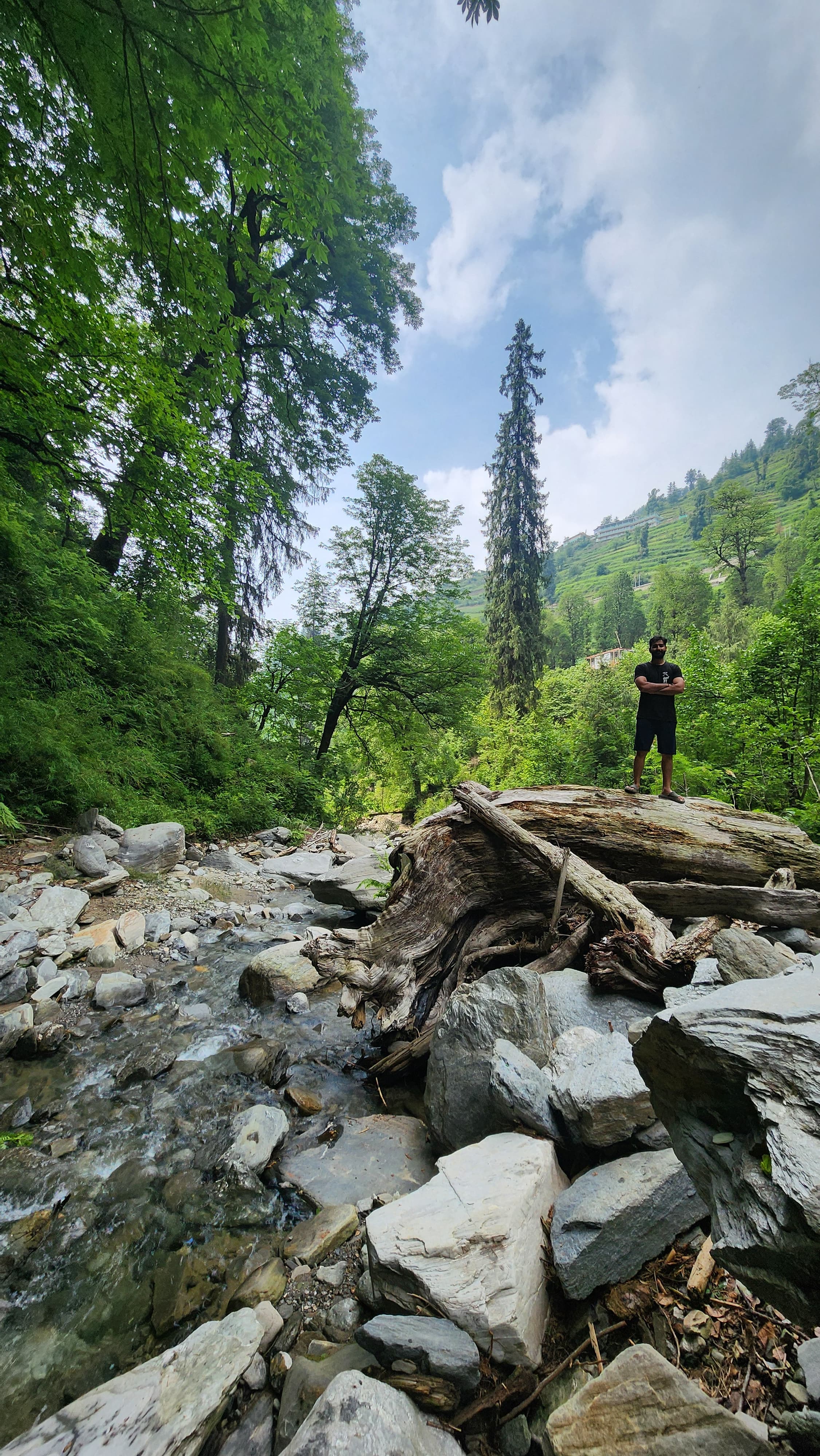 Travelers exploring a scenic river walk trail near Ailyak