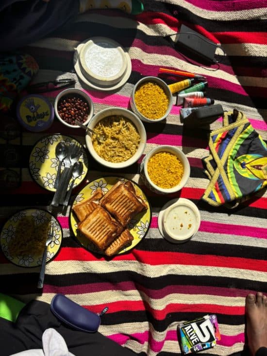 Picnic setup with cushions and local food