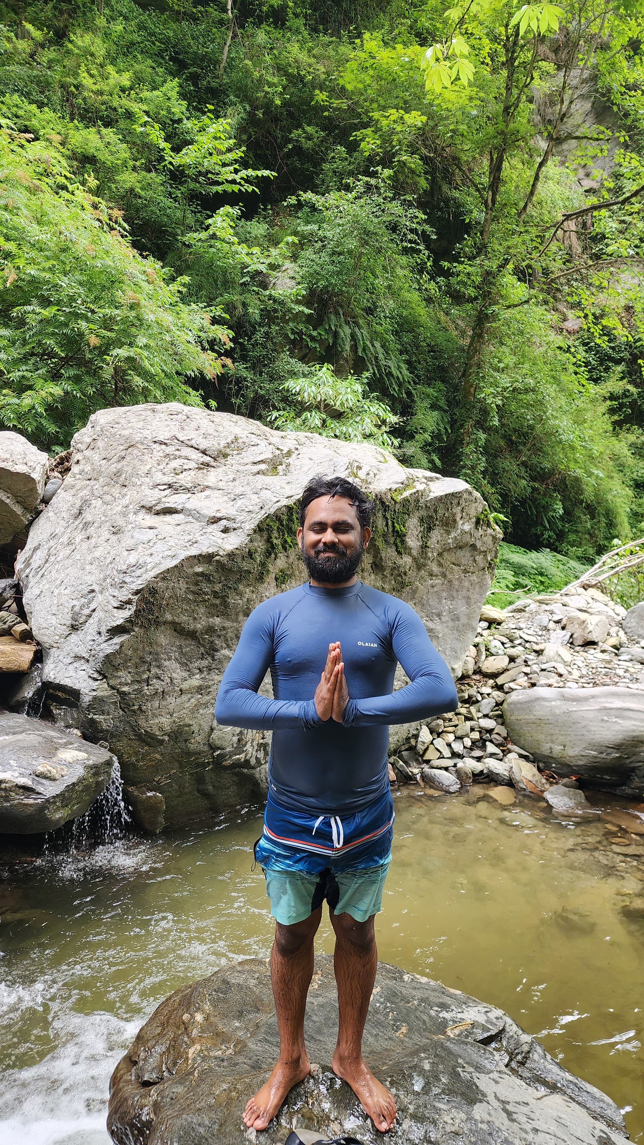 Morning yoga class in a riverside deck