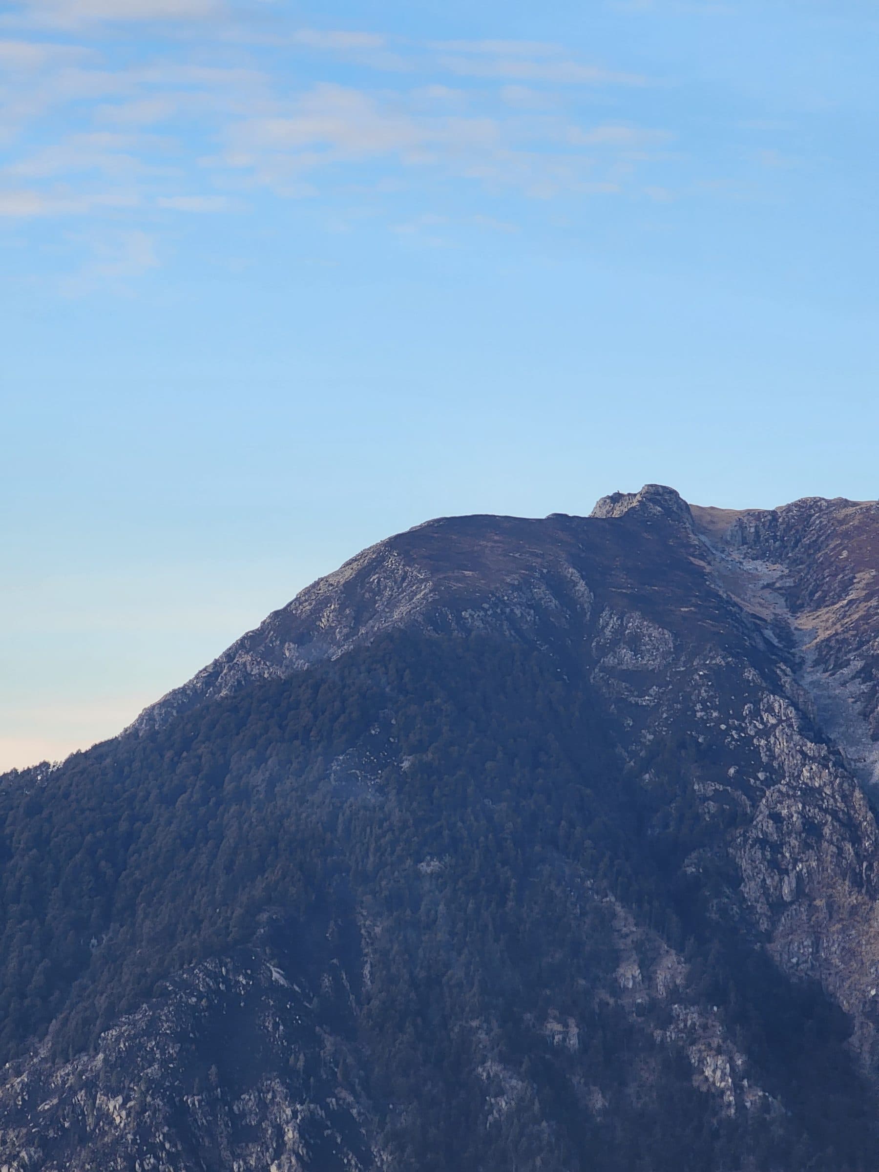 A picturesque waterfall cascading through the lush green landscape of Jibhi Valley, Himachal Pradesh, India